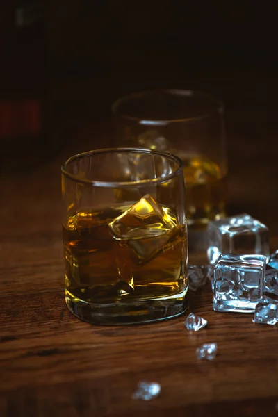 Shot of whiskey on old wooden surface — Stock Photo, Image