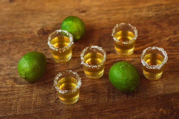 Tequila , lime and salt on wooden table — Stock Photo, Image