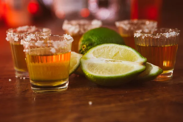 Tequila , lime and salt on wooden table — Stock Photo, Image