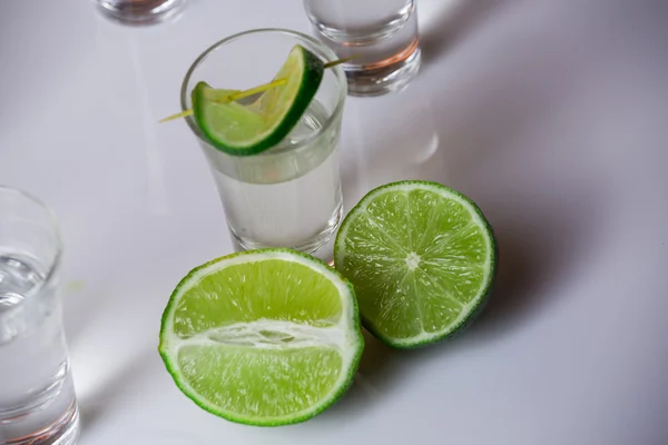 Tequila in glass on white — Stock Photo, Image