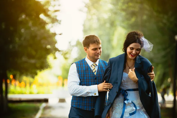 Photo of groom hugging bride at cold day — Stock Photo, Image