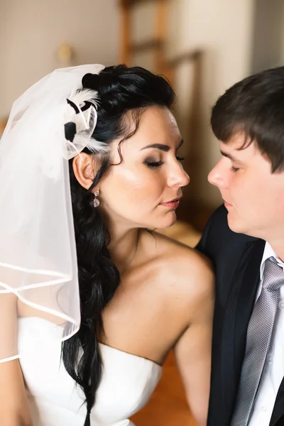 Beautiful young couple standing near the window — Stock Photo, Image