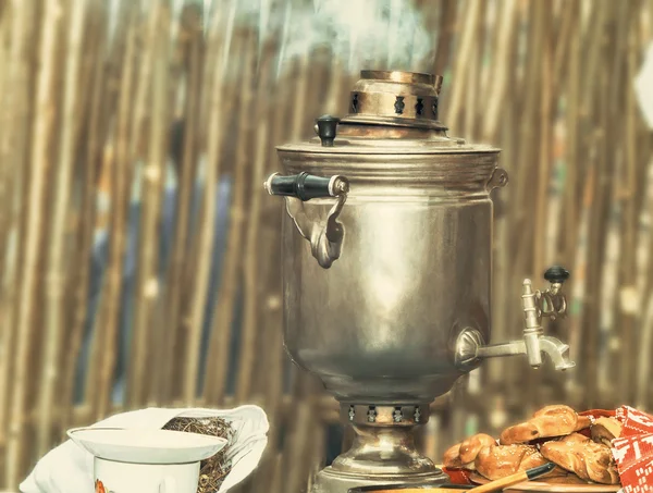 Boiling tea from the old samovar. — Stock Photo, Image