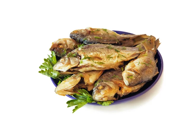 Roasted carp on a plate on a white background. — Stock Photo, Image