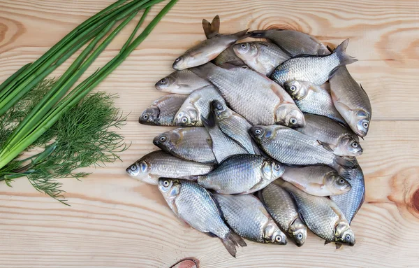 Fish hooked in the river on a table surface. — Stock Photo, Image