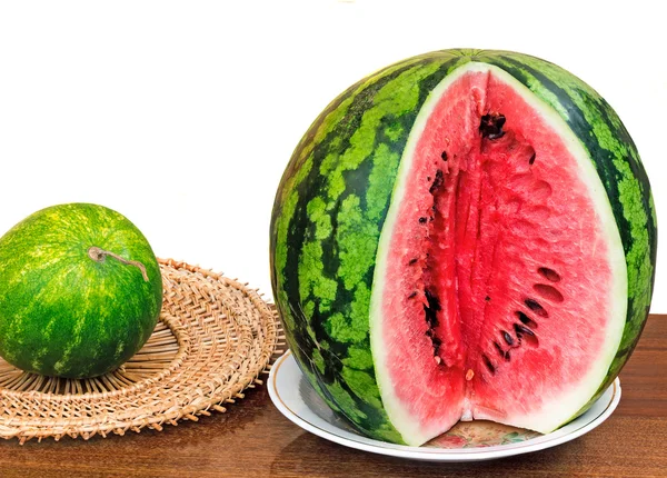 The ripe cut water-melon on a white background.