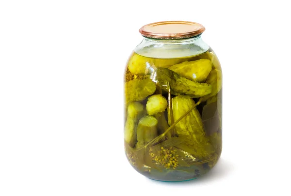 Home canning: glass cylinders with pickled cucumbers  on white b — Stock Photo, Image