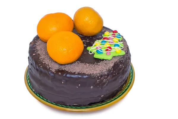 Chocolate cake and oranges on a ceramic dish on white background — Stock Photo, Image