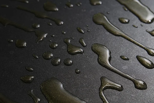 Hot oil on a pan close up dark background — Stock Photo, Image