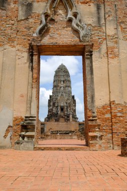 Old ruined buddhist temples and Palace in a green forest park in Ayutthaya landmark, Thailand
