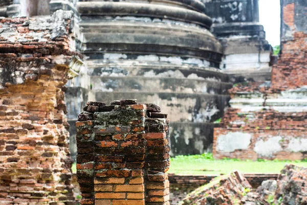 Old ruined buddhist temples and Palace in a green forest park in Ayutthaya landmark, Thailand