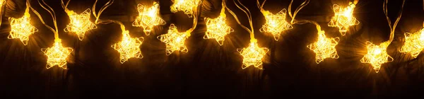 Garland Gold Wire Twisted Stars Black Background Golden Glowing Christmas — Stock Photo, Image