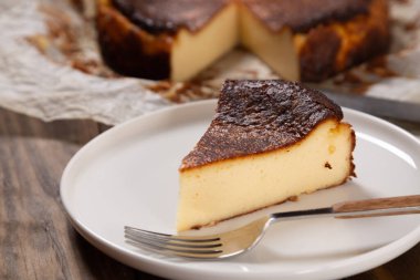 Portion of the traditional basque burnt cheesecake close up clipart