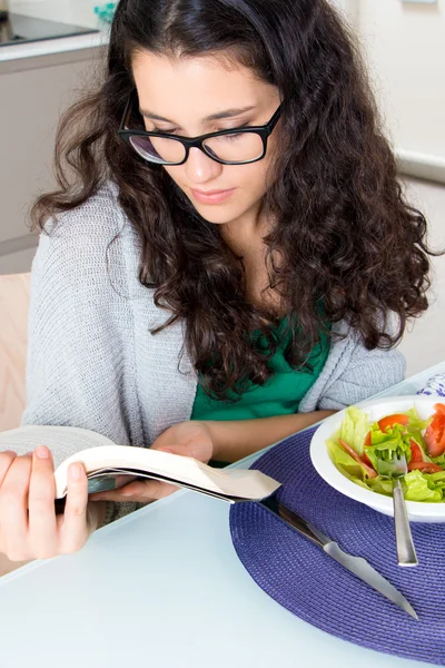 She is hooked on reading — Stock Photo, Image