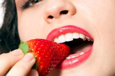 Sexy woman mouth biting strawberry clipart