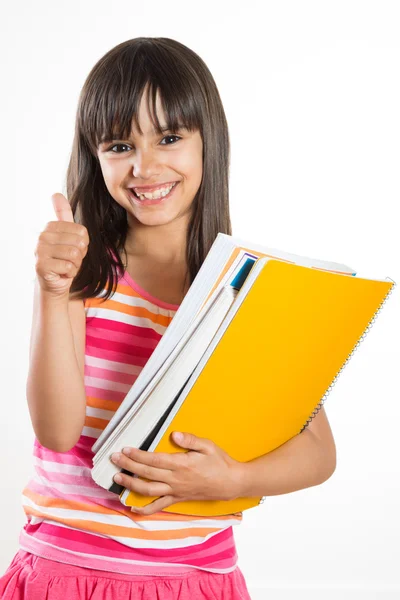 Jong en gelukkig school meisje met boeken duimen opdagen — Stockfoto