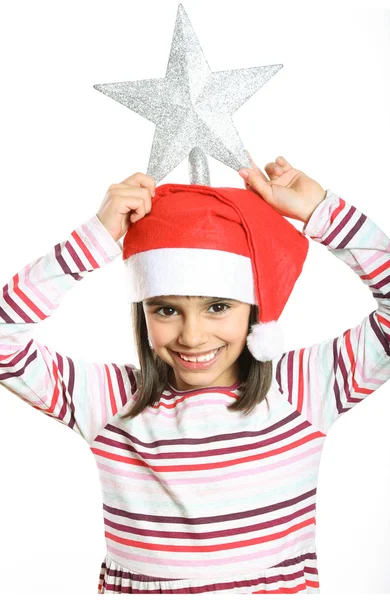 Pequena menina de Natal segurando uma estrela de árvore na cabeça — Fotografia de Stock