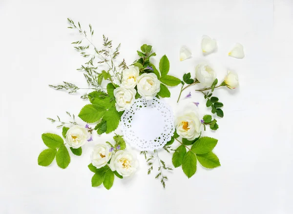 Composition with openwork doily and wild rose — Stock Photo, Image