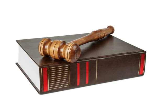 Wood gavel and soundblock on on a thick book — Stock Photo, Image