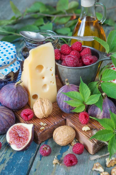 Still life with fruit, nuts and cheese — Stock Photo, Image