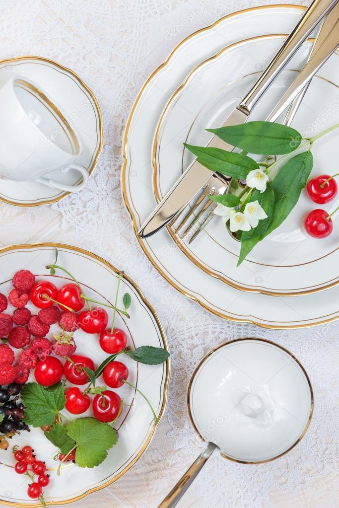 Beautiful table setting  with different berries