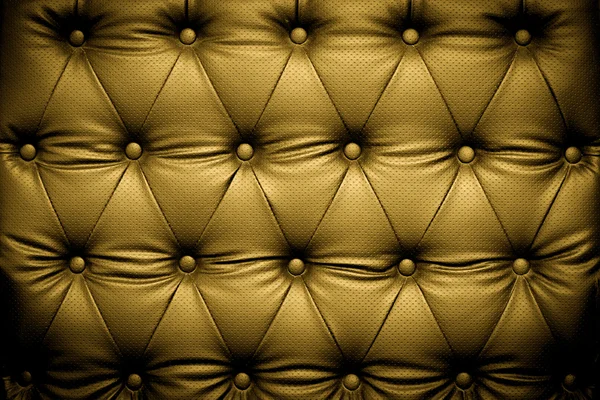 Luxe gouden leder texture met geknoopte patroon — Stockfoto