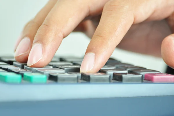 Fingers pressing on calculator keypad — Stock Photo, Image