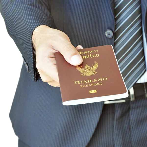 Businessman hand giving passport — Stock Photo, Image