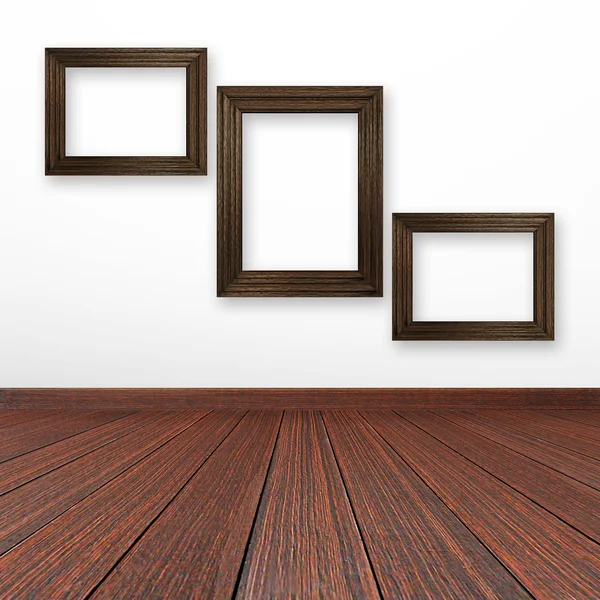Wooden picture frames on the wall — Stock Photo, Image