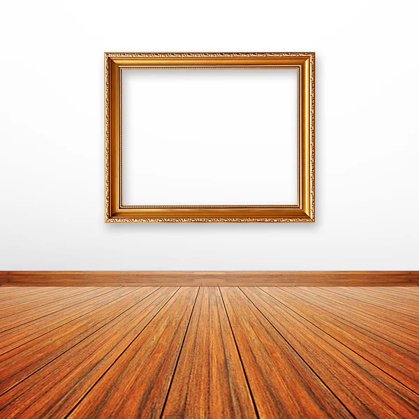 Golden picture frame on the wall — Stock Photo, Image