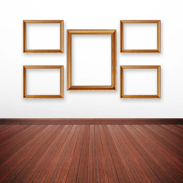 Gouden foto frames op de muur — Stockfoto