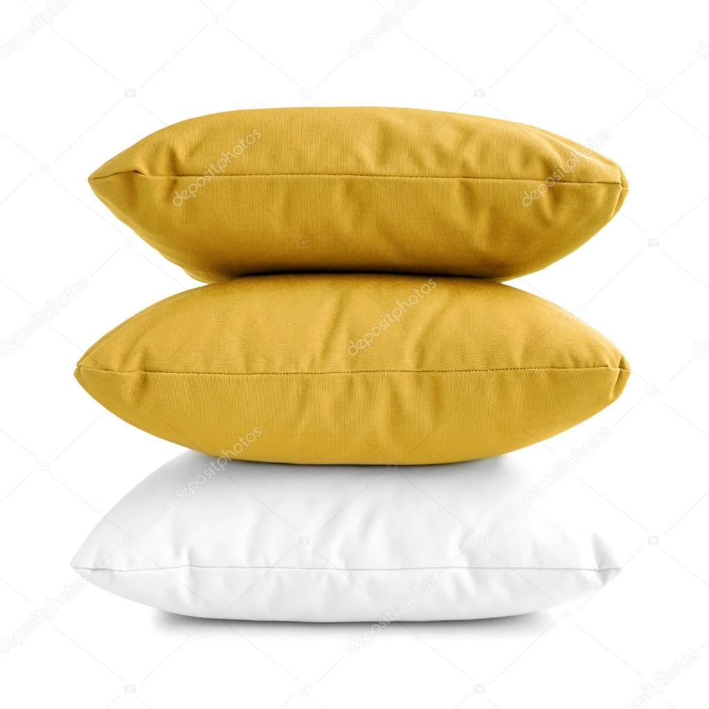Pillows - stack of three cushions on white background