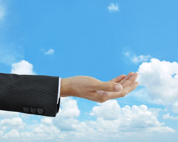 Empty hand on blue sky background — Stock Photo, Image