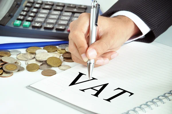 Hand pointing to VAT word on paper — Stock Photo, Image