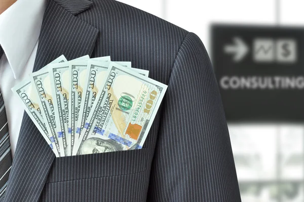 Dollar banknotes in pocket of businessman's suit — Stock Photo, Image