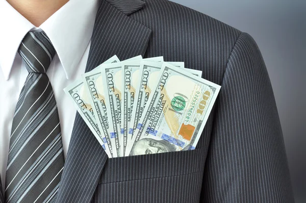 Billetes de dólar en el bolsillo del traje de hombre de negocios —  Fotos de Stock
