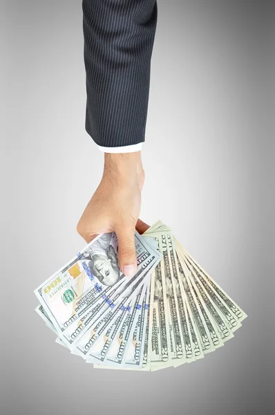 Geschäftsmann hält Dollars in der Hand — Stockfoto