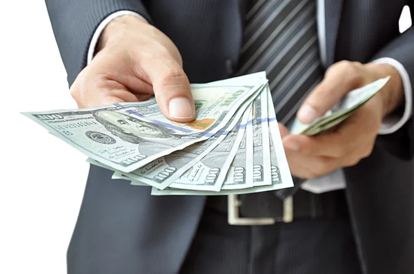 Hand giving money Dollars — Stock Photo, Image