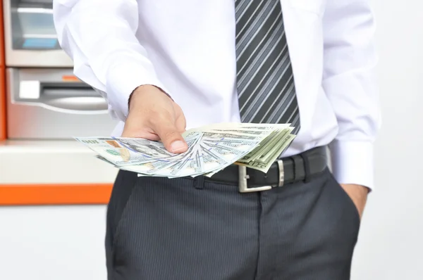 Hand holding dollar banknotes — Stock Photo, Image