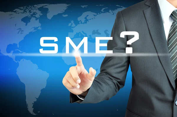 Businessman's hand touching SME sign — Stock Photo, Image