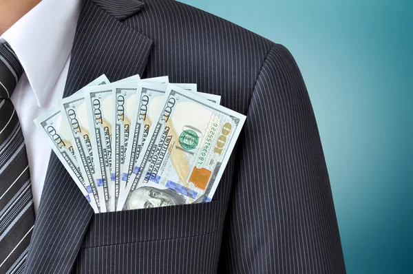 Dollar banknotes in pocket of businessman's suit — Stock Photo, Image