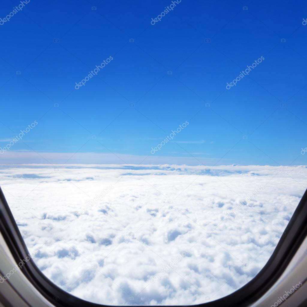 Cloudscape & horizon - aerial view from window of the airplane