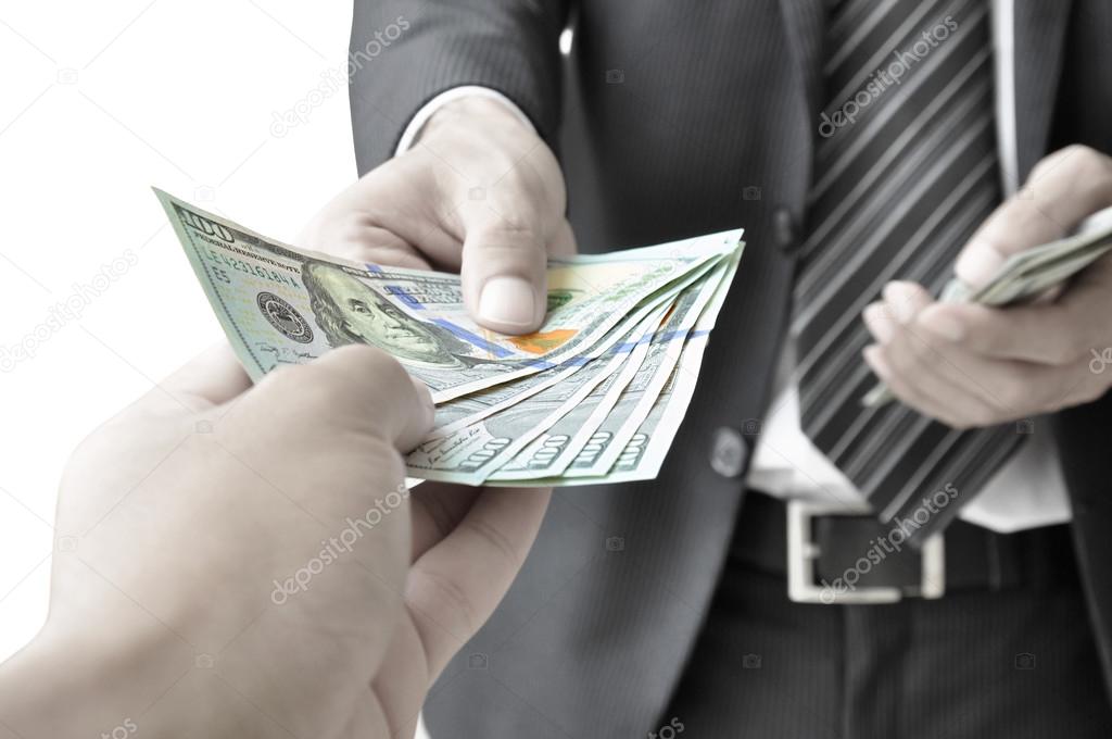 Hand giving money to another person