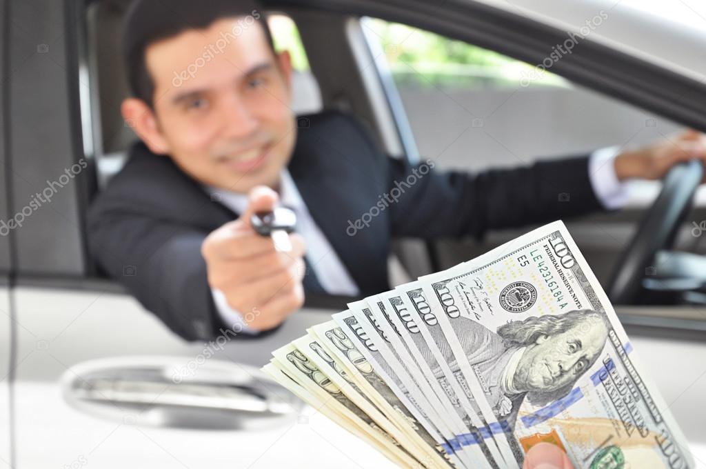 Businessman giving a car key