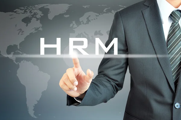 Businessman tangan menyentuh tanda HRM (atau Manajemen Sumber Daya Manusia) — Stok Foto