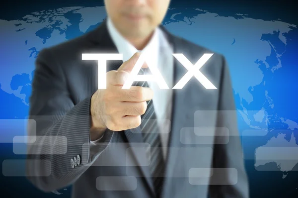 Hand pointing to TAX word — Stock Photo, Image