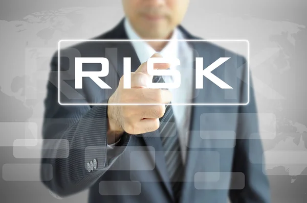 Hand pointing to RISK word — Stock Photo, Image