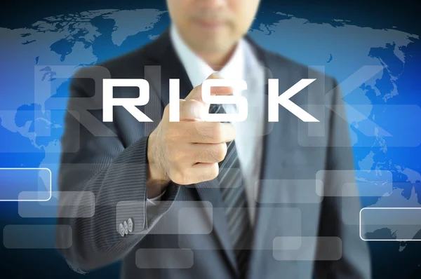 Hand pointing to RISK word — Stock Photo, Image