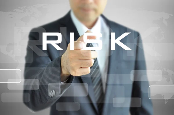 Mão apontando para a palavra RISK — Fotografia de Stock