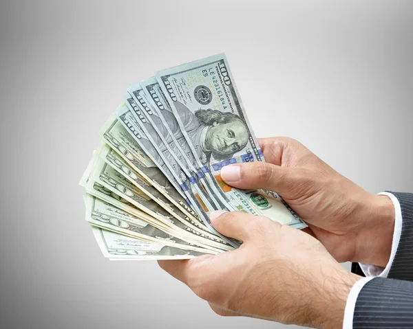 Hands holding money -  United States dollar (USD) bills — Stock Photo, Image